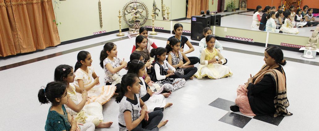A group of children sitting on the floor
